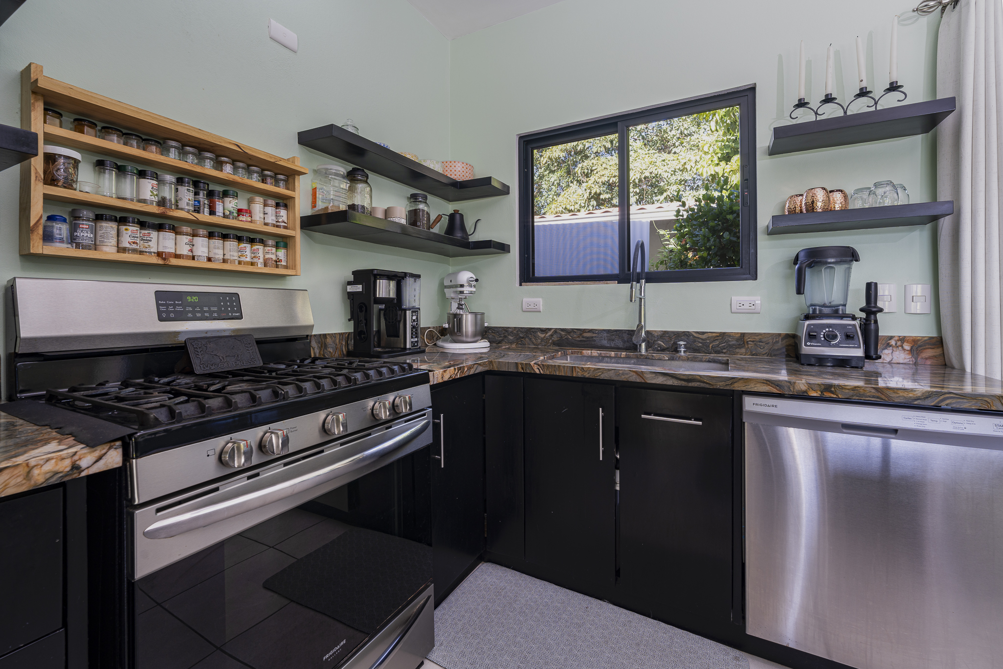 modern kitchen with granite countertops inside samara costa rica house